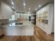 Modern kitchen featuring stainless steel appliances, granite countertops, white cabinets, and hardwood floors at 1394 Cherry Tree Rd, Avon, IN 46123