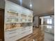 Kitchen cabinetry and countertop detail with a view of an adjoining living room at 1394 Cherry Tree Rd, Avon, IN 46123