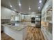 Bright kitchen with granite countertops, stainless steel appliances, and white cabinetry at 1394 Cherry Tree Rd, Avon, IN 46123