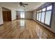 Spacious living room with wood floors, multiple windows, and open access to other rooms at 1394 Cherry Tree Rd, Avon, IN 46123