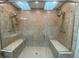 Luxury shower with dual shower heads, glass door, and built in shower bench at 1394 Cherry Tree Rd, Avon, IN 46123