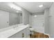 Bathroom featuring white cabinets and marble countertops, complemented by a modern bathtub and sink at 14 Fountain Lake Dr, Greenfield, IN 46140