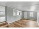 Well-lit bedroom with new wood floors, neutral paint, and a cozy, inviting atmosphere for relaxation at 14 Fountain Lake Dr, Greenfield, IN 46140