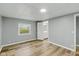 Well-lit bedroom with view to bathroom featuring modern flooring, enhancing the home's appeal at 14 Fountain Lake Dr, Greenfield, IN 46140