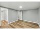 Bedroom showcasing neutral walls, modern flooring, and a smooth transition into the attached bathroom at 14 Fountain Lake Dr, Greenfield, IN 46140