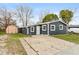 Charming single-story home with a concrete driveway and a quaint storage shed in the yard at 14 Fountain Lake Dr, Greenfield, IN 46140