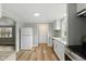Updated kitchen featuring sleek countertops, stainless steel appliances, and modern white cabinetry at 14 Fountain Lake Dr, Greenfield, IN 46140