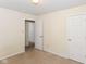 Bedroom with neutral walls, carpet, and white trim on the doors and baseboards at 1414 Waldemere Ave, Indianapolis, IN 46241