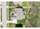 An aerial view of a home showing the roof, driveway, backyard, and surrounding neighborhood at 14413 Arnett Dr, Carmel, IN 46033