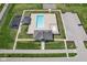 An aerial view highlighting the community pool, bath house, playground, and sports court at 14413 Arnett Dr, Carmel, IN 46033