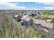 An aerial view showing a house nestled in a residential community with lush greenery and nearby amenities at 14413 Arnett Dr, Carmel, IN 46033