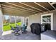 Back patio area with a table, chairs, grill and smoker, ideal for outdoor dining and entertaining at 14413 Arnett Dr, Carmel, IN 46033