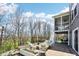 The outdoor patio provides cozy furniture around a firepit, perfect for relaxation and backyard entertaining at 14413 Arnett Dr, Carmel, IN 46033