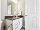 Well-lit bathroom with a modern vanity, mirror, and white cabinets at 14413 Arnett Dr, Carmel, IN 46033