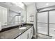 Modern bathroom featuring a white sink vanity, framed mirror, and glass shower doors at 14413 Arnett Dr, Carmel, IN 46033