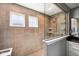 This bathroom features a walk-in shower with a glass partition, tiled walls, and tiled floors at 14413 Arnett Dr, Carmel, IN 46033