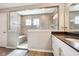 This bathroom features a tiled walk-in shower, vanity with sink, and tiled floors at 14413 Arnett Dr, Carmel, IN 46033