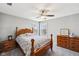 This carpeted bedroom features two windows, wood furniture, and gray paint at 14413 Arnett Dr, Carmel, IN 46033