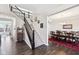 Welcoming foyer with a staircase leading to the upper level and a view into the formal dining room at 14413 Arnett Dr, Carmel, IN 46033