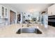 Spacious kitchen with a large island, modern appliances, and an open view into the living area at 14413 Arnett Dr, Carmel, IN 46033