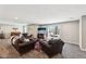 Inviting living area with comfortable leather furnishings and sliding glass doors to outdoors at 14413 Arnett Dr, Carmel, IN 46033
