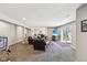 Open-concept living space with large seating, a flat screen TV, and access to the outdoors at 14413 Arnett Dr, Carmel, IN 46033