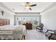 The main bedroom features four windows, a ceiling fan, and gray paint at 14413 Arnett Dr, Carmel, IN 46033