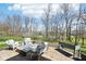 Outdoor patio featuring comfortable wicker chairs around a fire pit for relaxation and entertainment at 14413 Arnett Dr, Carmel, IN 46033