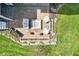 Aerial view of a backyard patio featuring a fire pit and comfortable seating for outdoor entertainment at 14413 Arnett Dr, Carmel, IN 46033