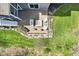 Aerial view of a backyard patio featuring a fire pit and outdoor seating arrangement, ready for relaxation at 14413 Arnett Dr, Carmel, IN 46033