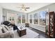 Cozy sun room with large windows, allowing for ample natural light and relaxing views at 14413 Arnett Dr, Carmel, IN 46033