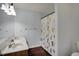 Bathroom with a double vanity, hard surface countertop, and shower with pineapple curtain at 1444 Trail Creek Ct, Carmel, IN 46032
