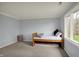 Bedroom featuring a twin bed, neutral carpet, and a large window with a view at 1444 Trail Creek Ct, Carmel, IN 46032