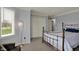 Bedroom with a metal bed frame, a decorative floor lamp, and a window to let in natural light at 1444 Trail Creek Ct, Carmel, IN 46032
