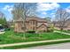 Charming brick home with a well-kept lawn and mature landscaping at 1444 Trail Creek Ct, Carmel, IN 46032