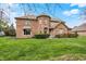 Inviting brick house with manicured lawn, offering classic curb appeal at 1444 Trail Creek Ct, Carmel, IN 46032
