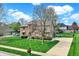 Brick two-story home featuring a well-manicured lawn and inviting curb appeal at 1444 Trail Creek Ct, Carmel, IN 46032