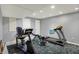 Basement gym with exercise machines, patterned carpet and white walls at 1444 Trail Creek Ct, Carmel, IN 46032