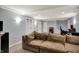 Finished basement with recessed lights, carpet, a cozy couch, and a doorway at 1444 Trail Creek Ct, Carmel, IN 46032