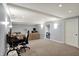 Spacious basement with recessed lighting, comfortable seating, and versatile layout at 1444 Trail Creek Ct, Carmel, IN 46032