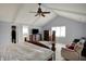Bright main bedroom with vaulted ceilings, a walk-in closet, and comfortable seating at 1444 Trail Creek Ct, Carmel, IN 46032