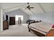 Spacious main bedroom featuring vaulted ceilings, a cozy seating area, and plenty of natural light at 1444 Trail Creek Ct, Carmel, IN 46032