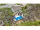Aerial view of the property showcasing the backyard pool, deck, and landscaped areas in a suburban setting at 15385 Ellington Dr, Fishers, IN 46040