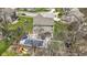 High-angle view of the property highlighting the swimming pool, deck, and yard features in a suburban setting at 15385 Ellington Dr, Fishers, IN 46040