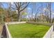 Spacious backyard with artificial turf and a fenced perimeter, offering a low-maintenance play area at 15385 Ellington Dr, Fishers, IN 46040