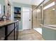 A modern bathroom with glass shower, storage and fresh paint at 15385 Ellington Dr, Fishers, IN 46040