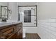 A modern bathroom featuring dark wood floors and a subway tiled shower with a glass door at 15385 Ellington Dr, Fishers, IN 46040