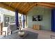 Inviting outdoor living area with a TV, comfortable seating, and a cozy atmosphere at 15385 Ellington Dr, Fishers, IN 46040