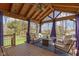 Spacious covered patio area with comfortable seating, a ceiling fan, and string lights at 15385 Ellington Dr, Fishers, IN 46040