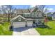 Lovely two-story home featuring a convenient three-car garage, lush green lawn, and inviting front porch at 15385 Ellington Dr, Fishers, IN 46040